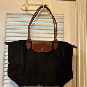 New Longchamp canvas bag. Never used. Leather handles